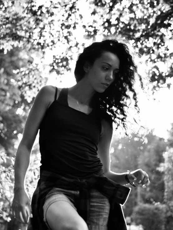 a girl in black top riding an old tricycle