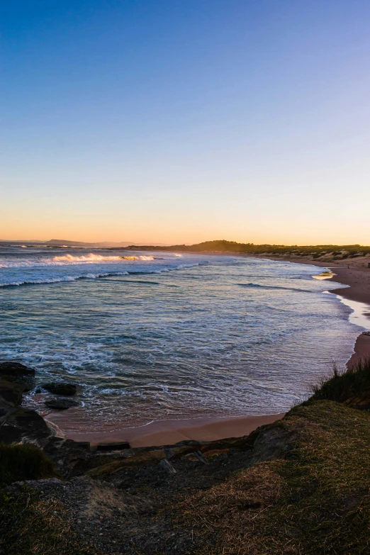 a po of a beautiful beach at dusk