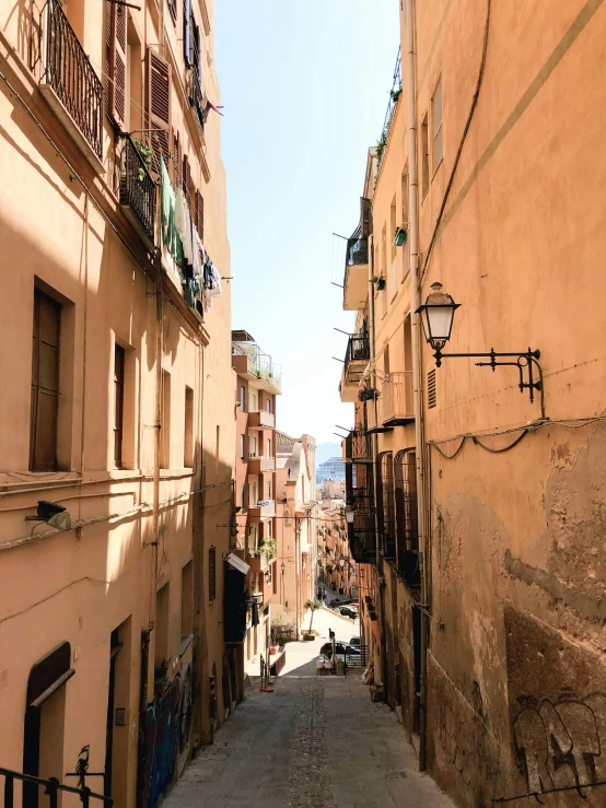 an old town has a narrow street surrounded by buildings