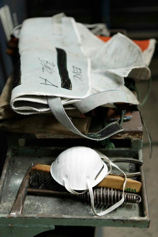 a bag filled with a hair brush and mirror