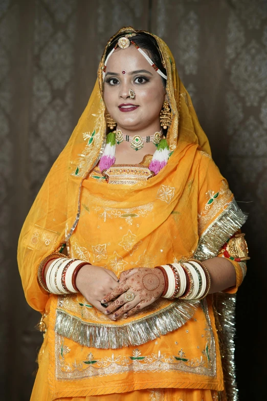 a woman in yellow clothes standing up