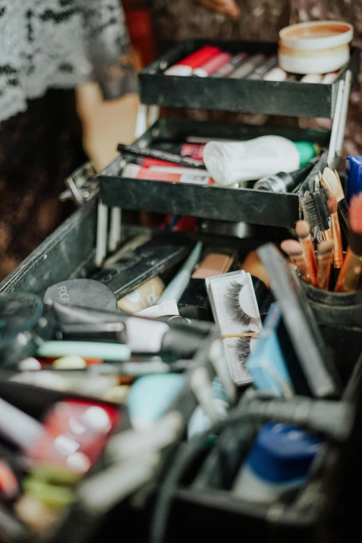 an open box filled with lots of art supplies