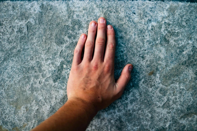 the hand of an overweight person on the floor