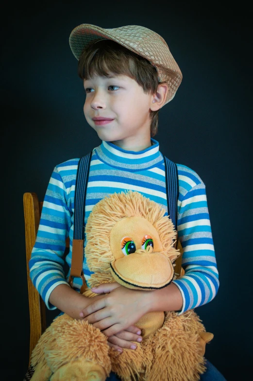a child wearing a brown monkey toy while holding a stuffed animal