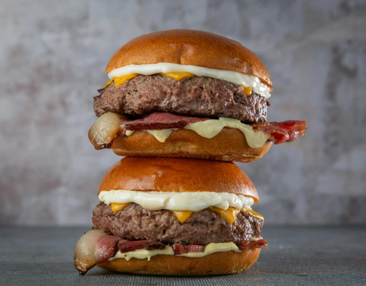 two hamburgers stacked on top of each other