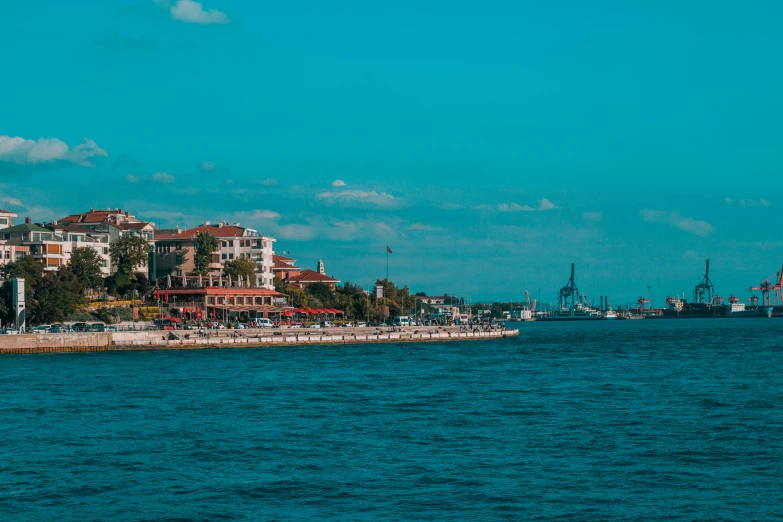 the water in front of the beach in a large city