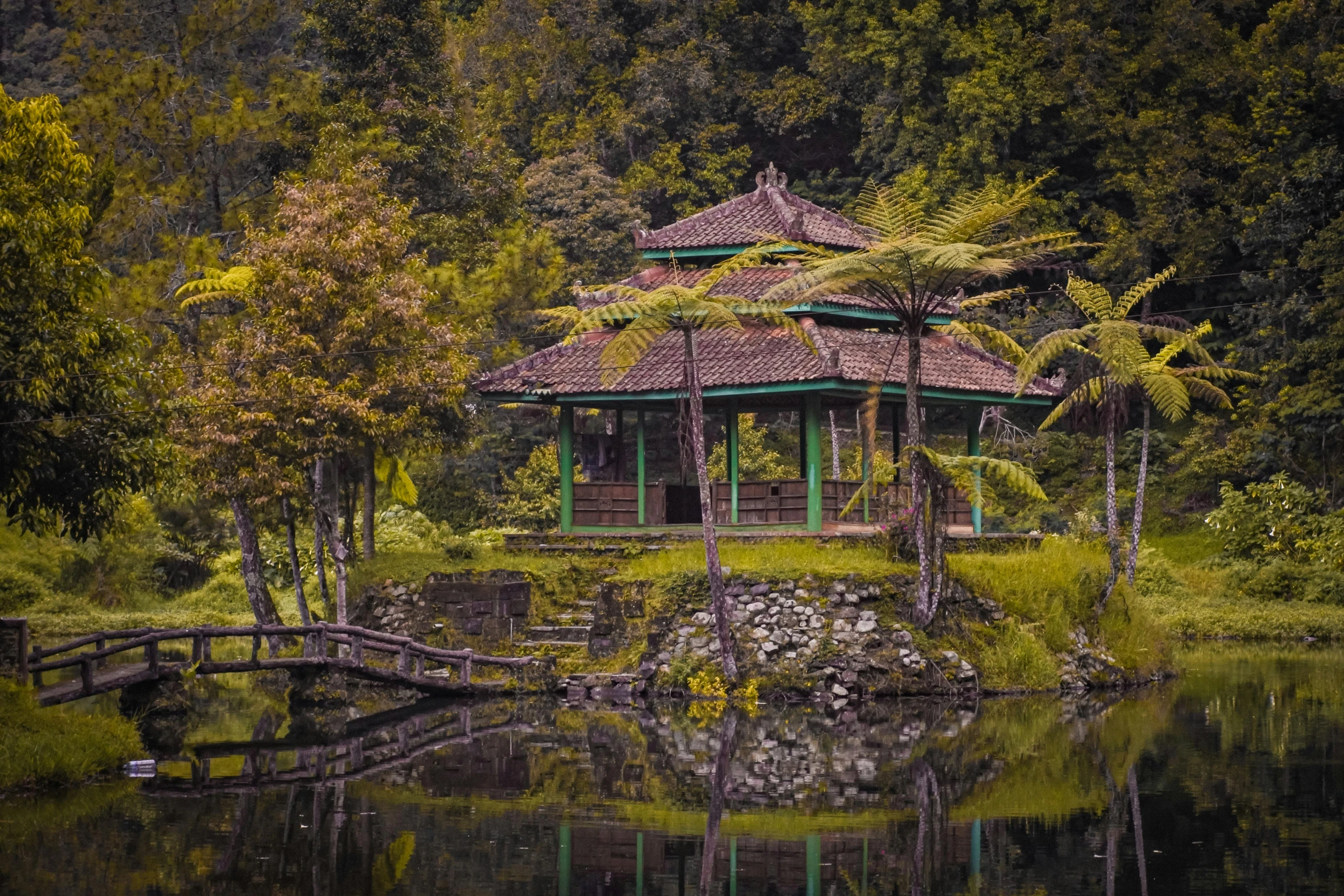 a gazebo is next to a small body of water