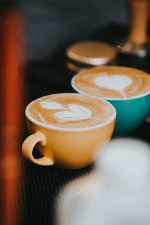 two cups of coffee are next to each other