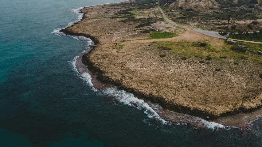 an island with an ocean view is seen from above