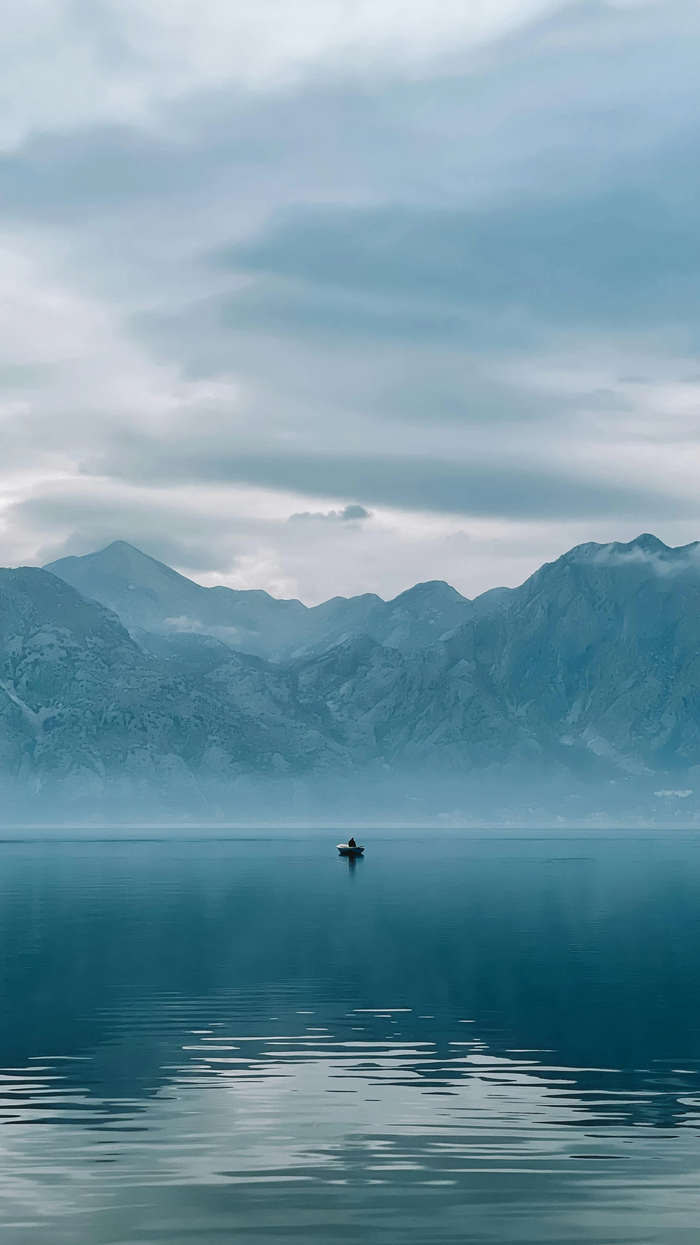 the boat is floating in the calm water