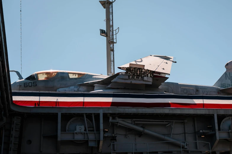 military plane with american flag striped parts sitting at station