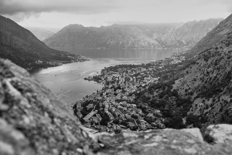 a view from a high point of a mountain looking down at the city below