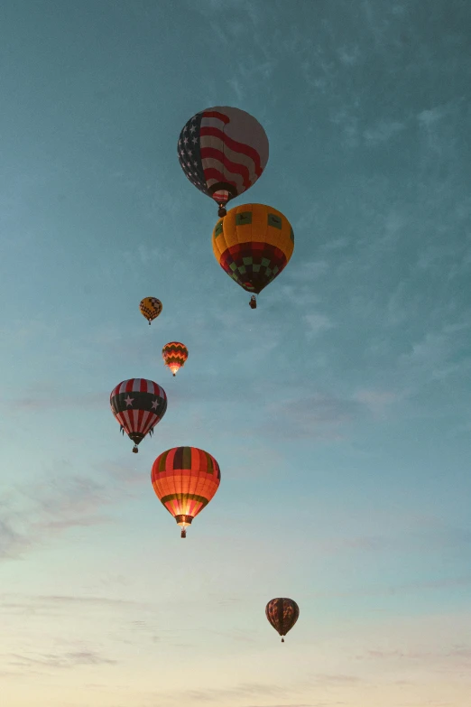 a couple of  air balloons in the sky