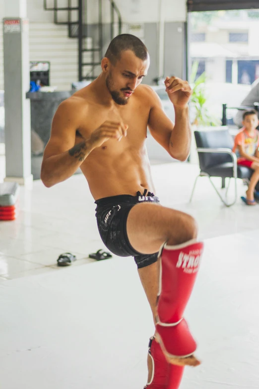 an image of a man doing some kickbox exercises