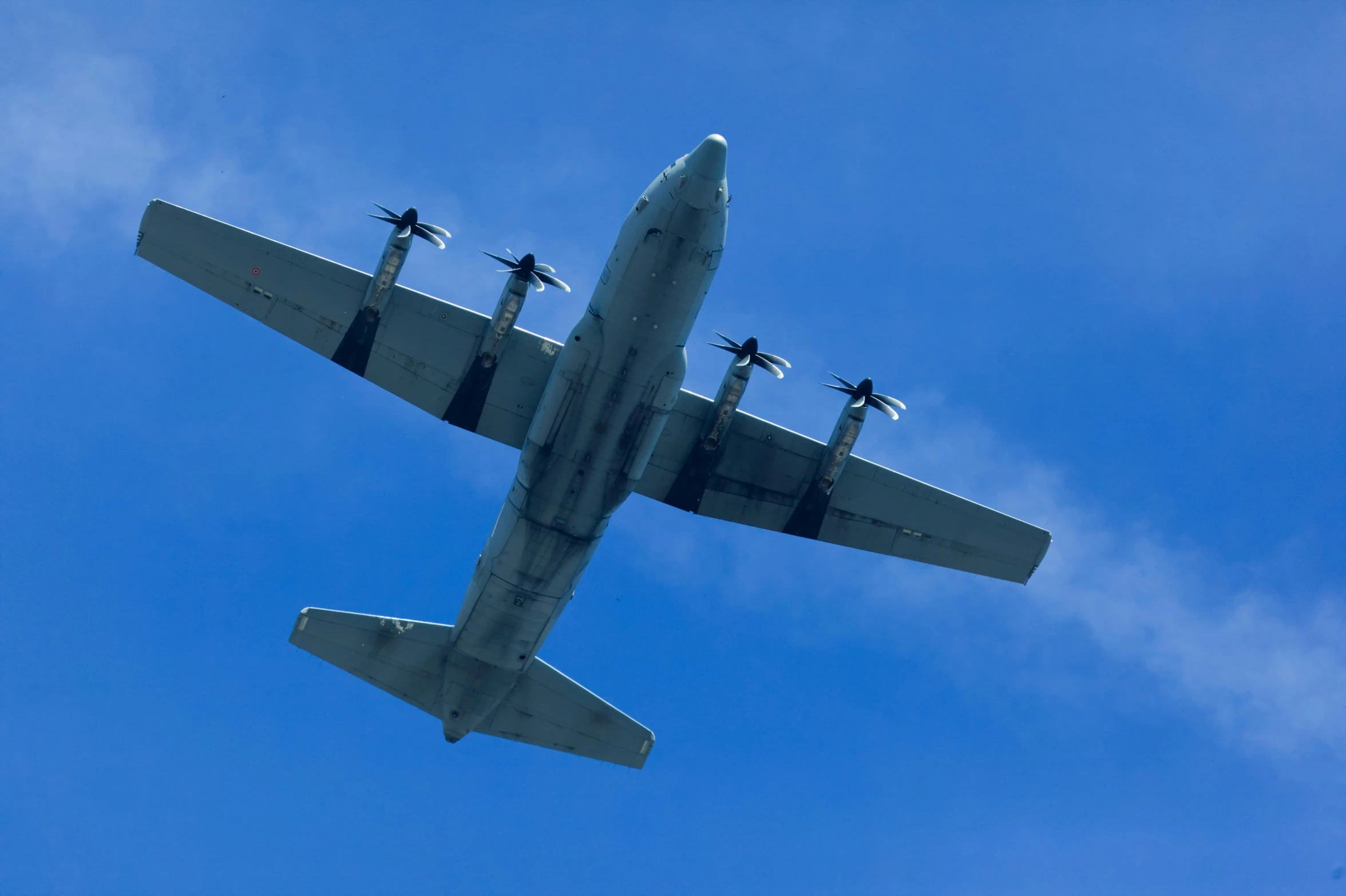 a large jetliner flying through a blue sky