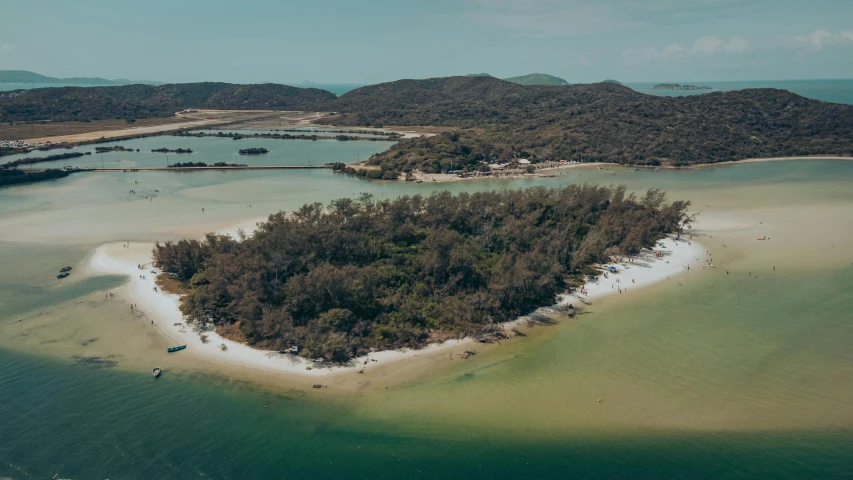 an aerial view of a small island on some water