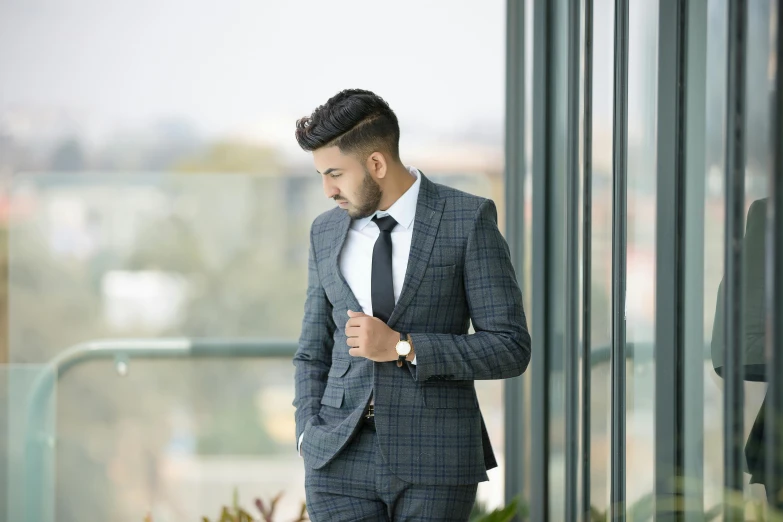 a man standing outside in a suit and tie