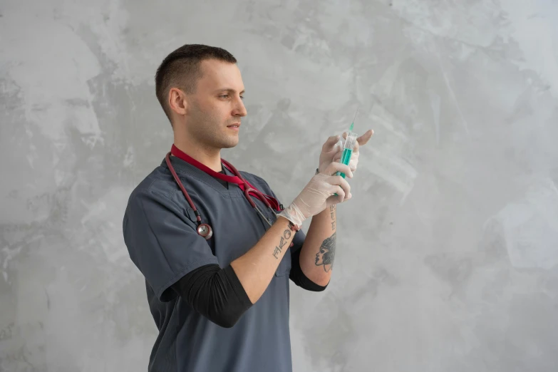 man wearing medical gloves holding a small model airplane