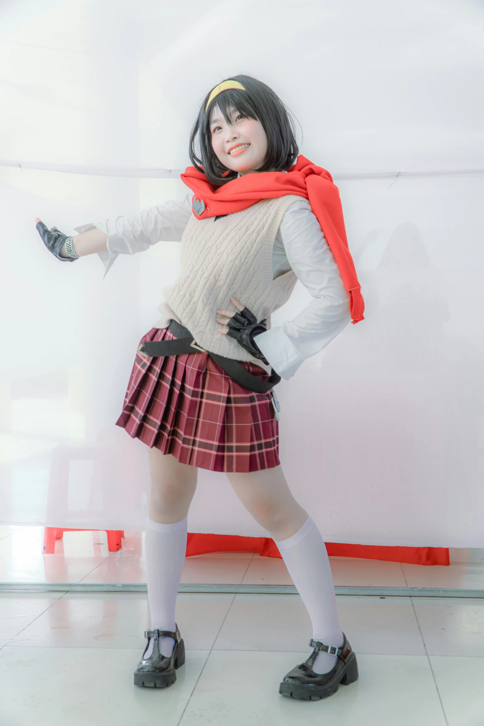 an asian girl in a school uniform poses