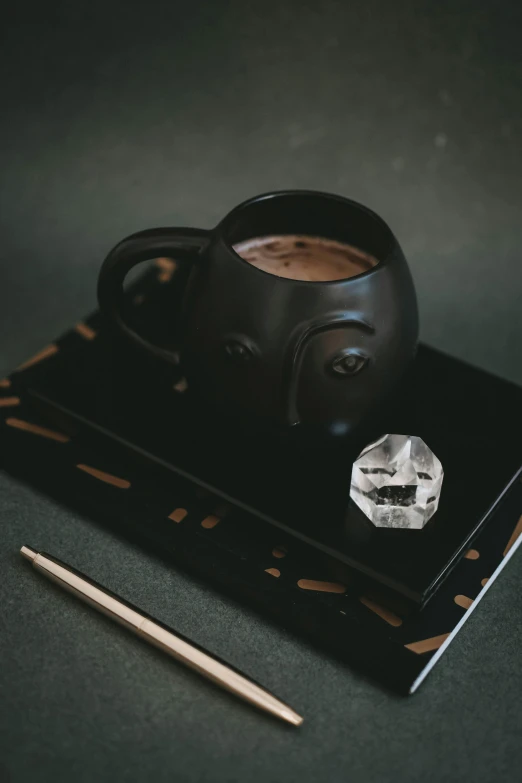 coffee is placed on a black tray