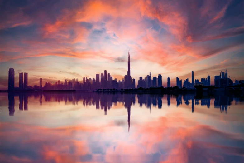 city buildings reflected in the still waters of a lake