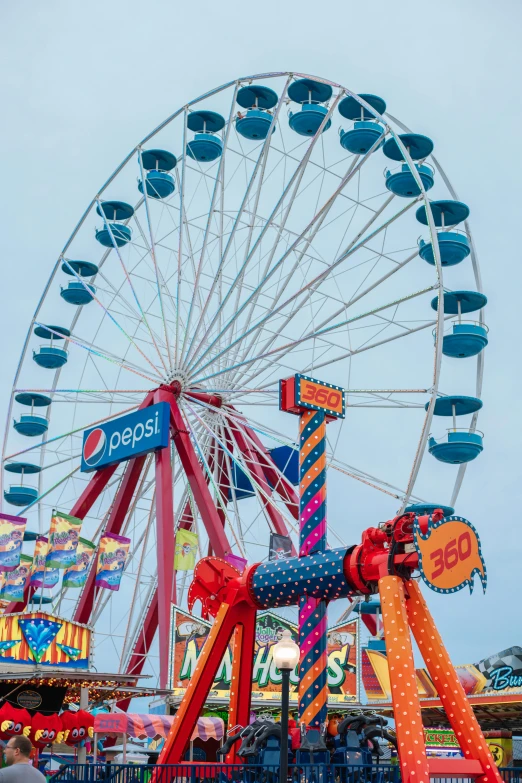 an amut park with lots of colorful rides