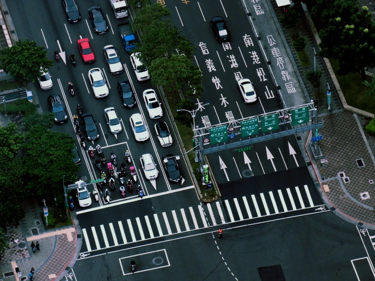 a top view of a city street filled with traffic