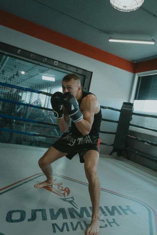 a boxer in boxing ring prepares to take a corner