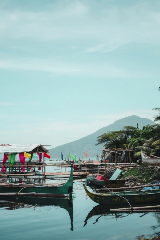 some boats are sitting in the water