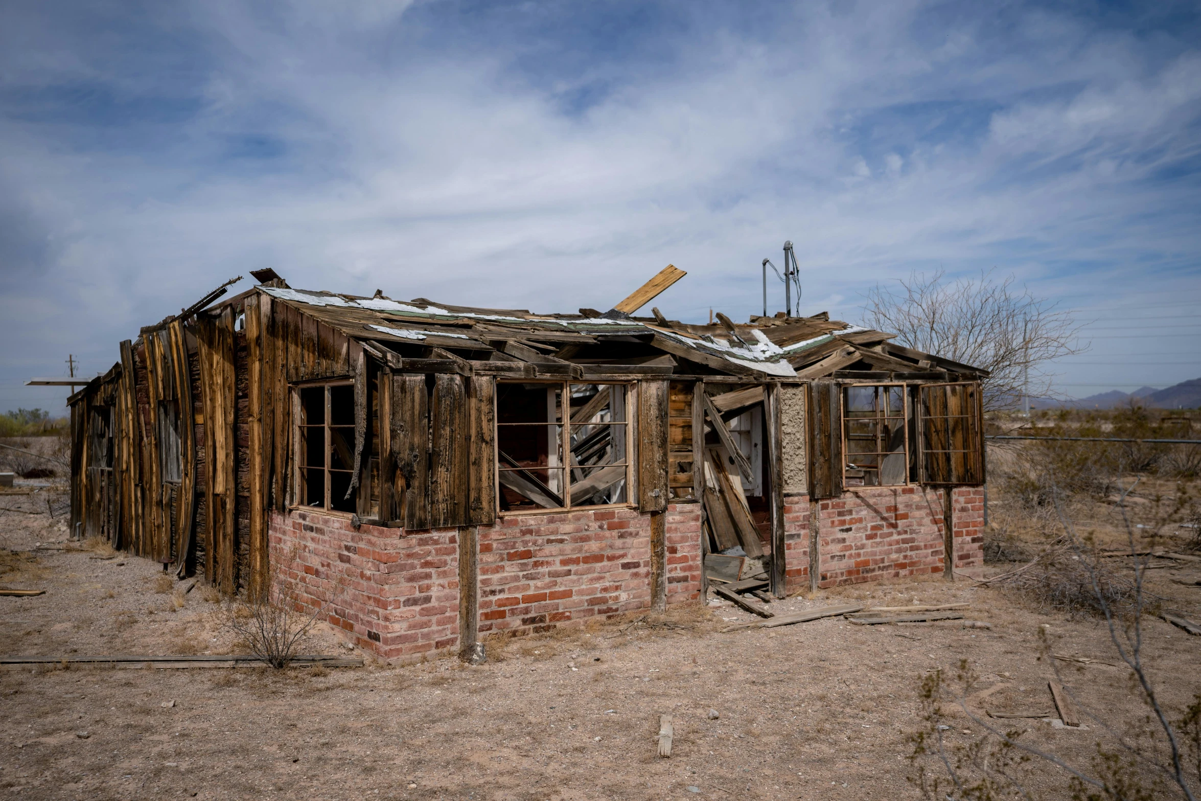 a brick building sitting in the middle of a desert