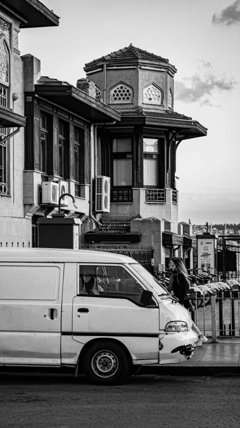 a van parked in front of a building