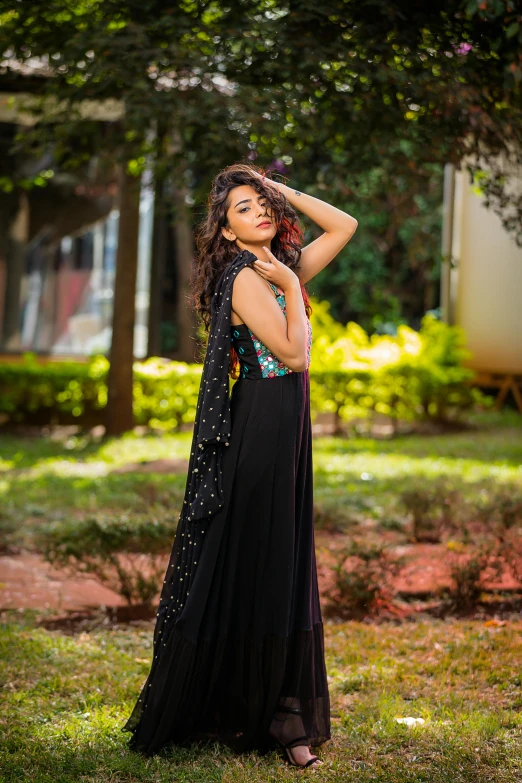 a beautiful young woman wearing a black dress