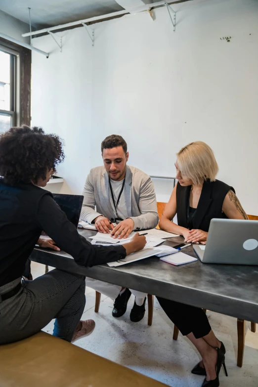 a group of people are sitting at a table