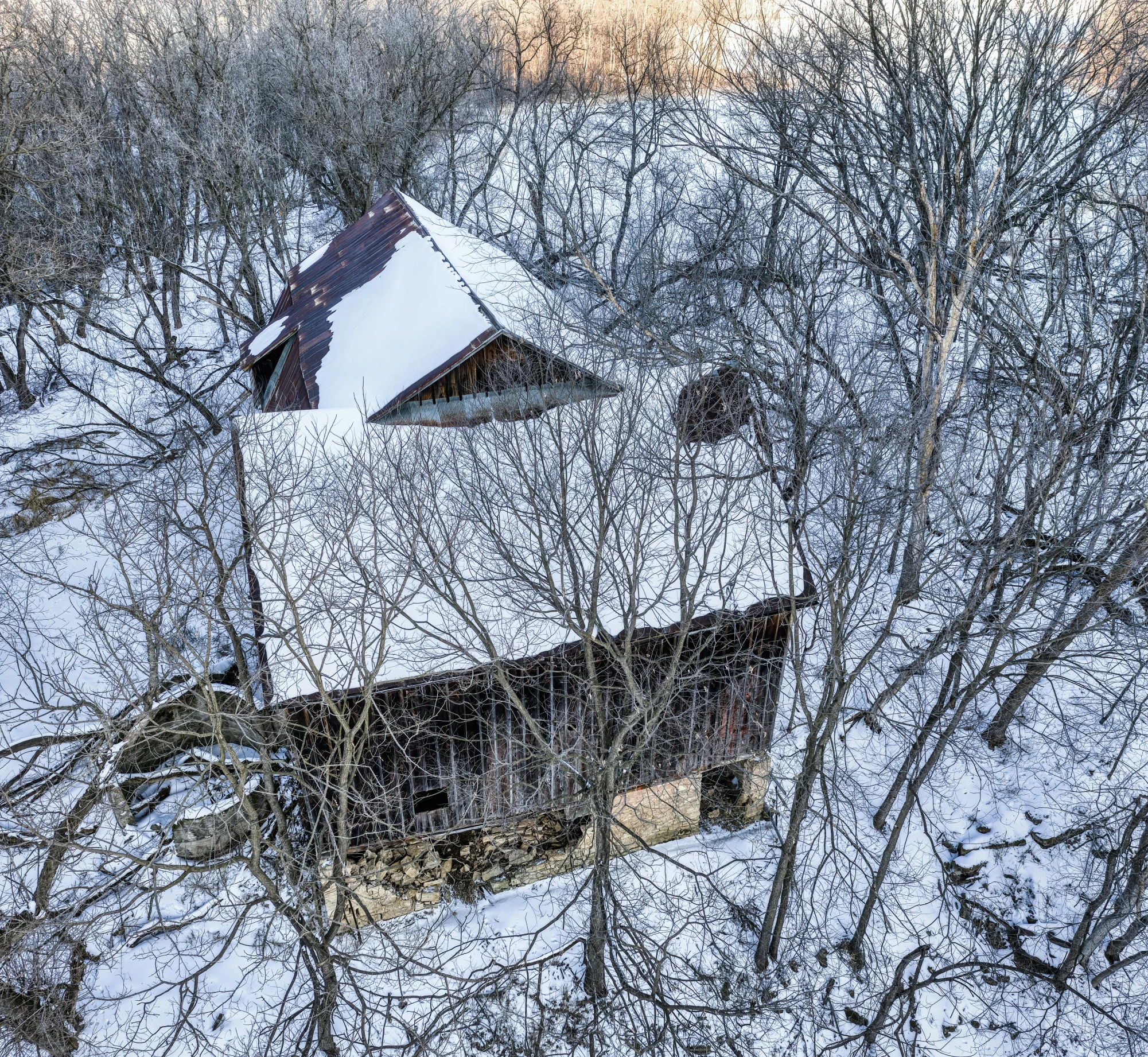 a church is in the woods, and snow is everywhere