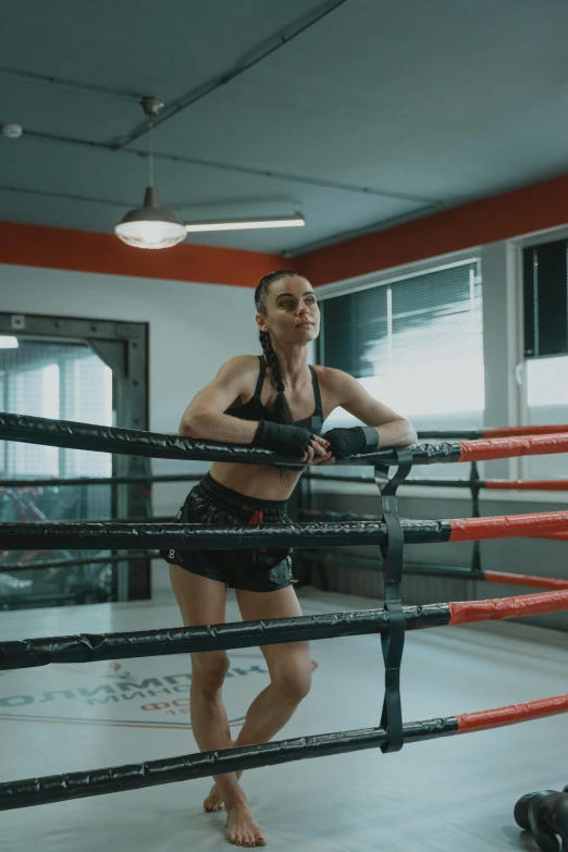 the woman is practicing her boxing ss in a gym