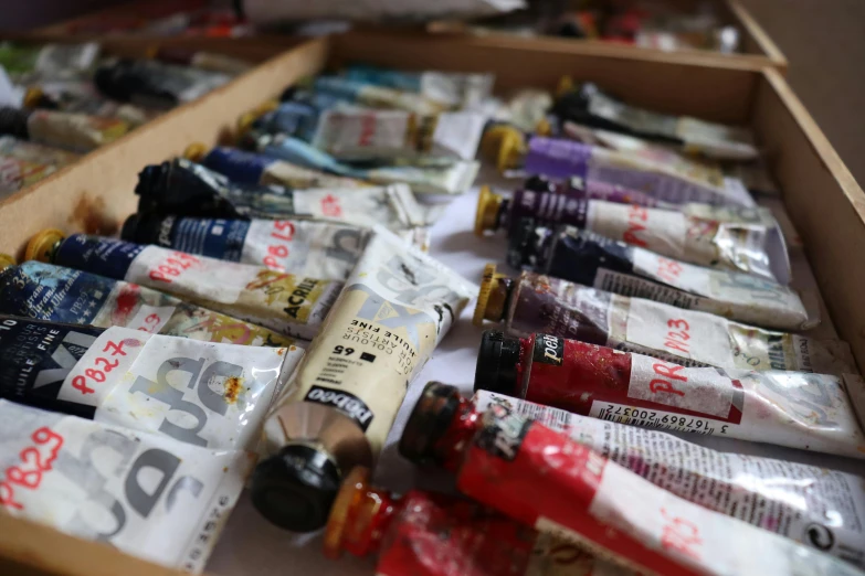 many packets of pills are laid out on the floor