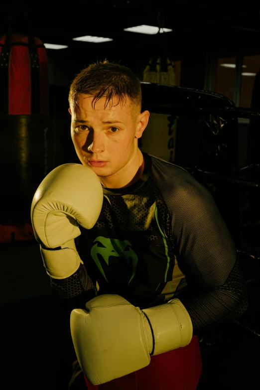 a  is posing with his boxing gloves