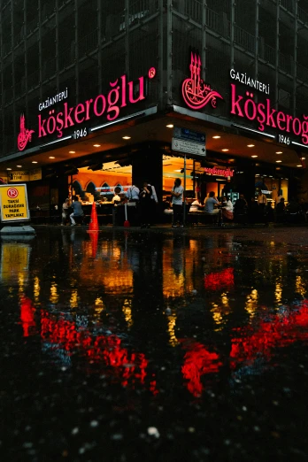 the restaurant is surrounded by the rain on the street