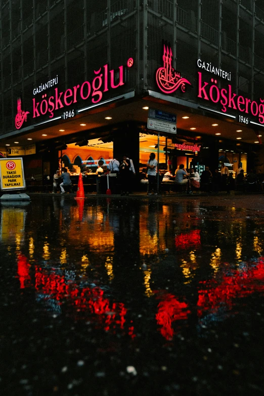 the restaurant is surrounded by the rain on the street