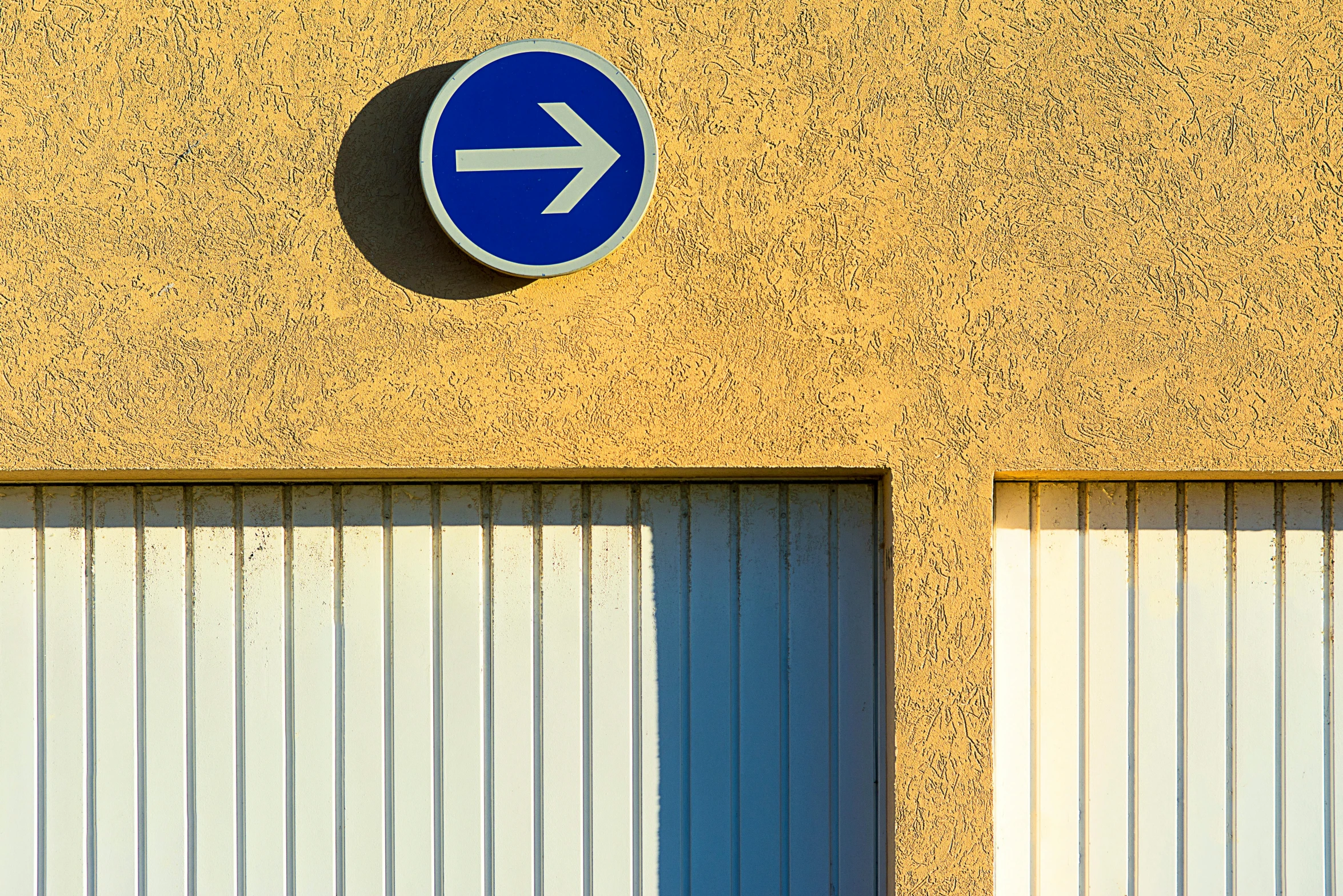 a sign is shown next to an open garage door