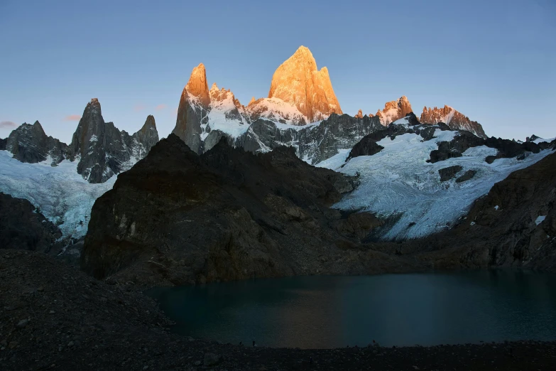 a view of an area that has snow on it, with mountains at the far end