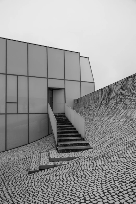 a large stone structure next to a building