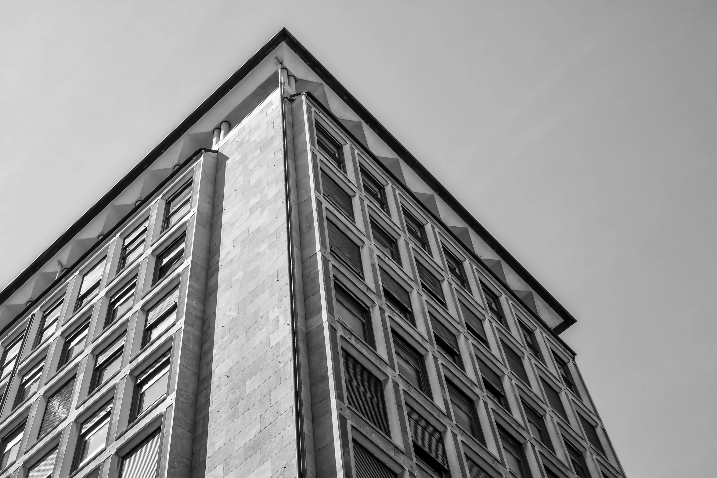 black and white pograph of a tall brick building