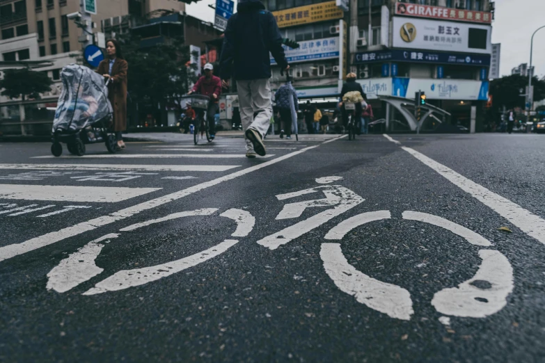 a close up of a cross walk with buildings in the background