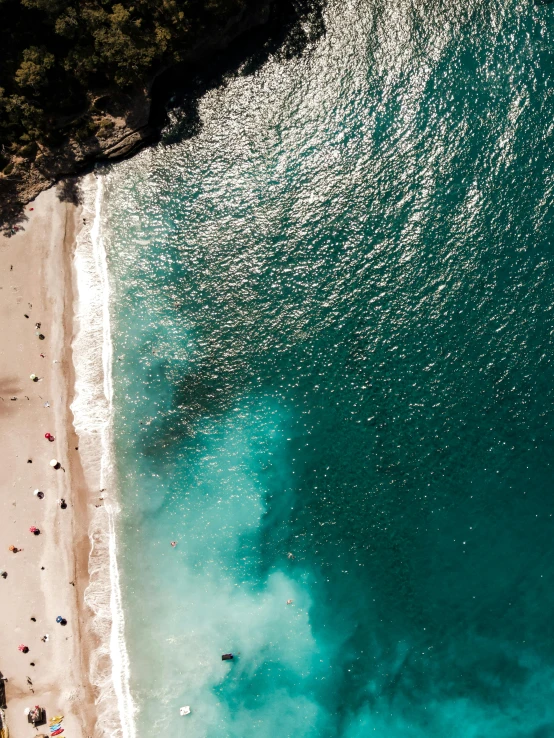 a view of some water next to a beach