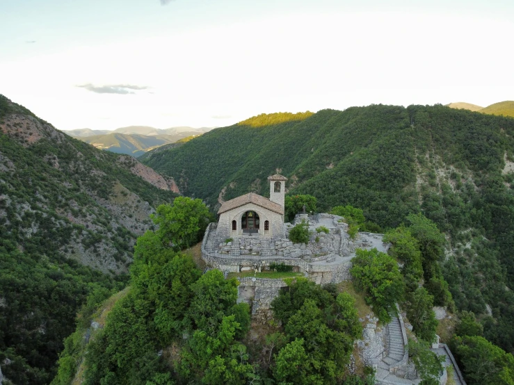 a large castle surrounded by lush green trees