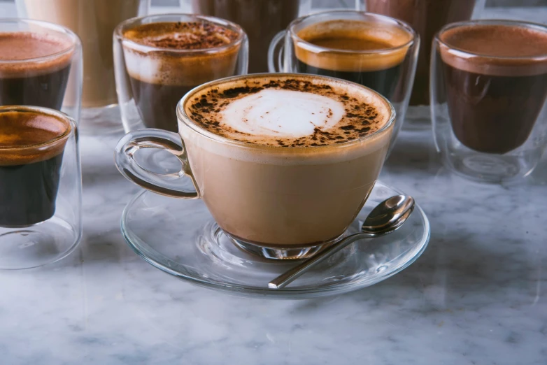 several different drinks are shown in separate glasses