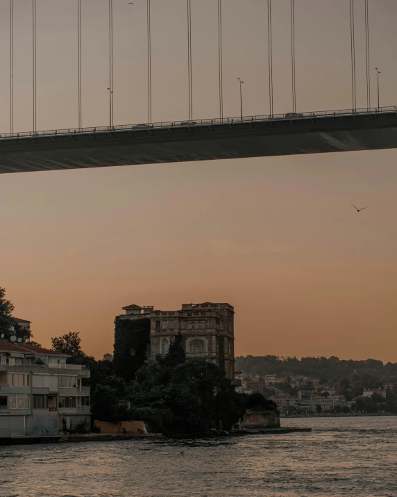 a bridge with the top of it built over water