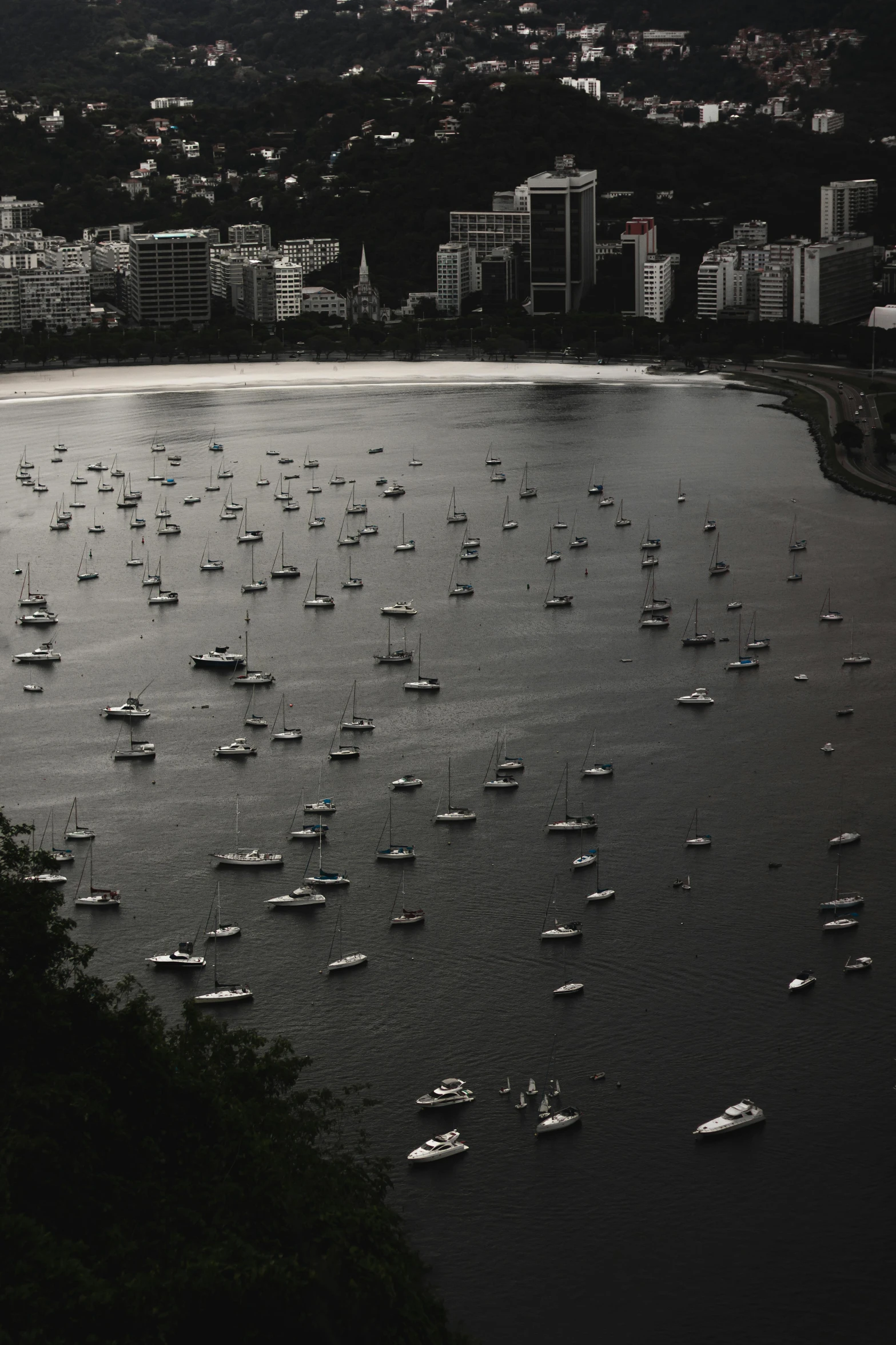 a group of boats sailing on a body of water