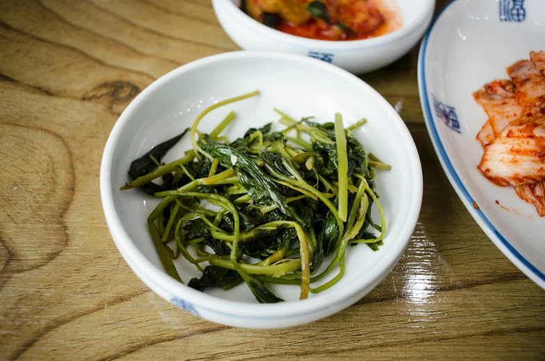 a bowl that has some green food in it